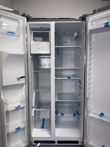 A close-up view of the filtered water and ice dispenser on the FRIGIDAIRE FRSS2323AS, for sale in Kansas.