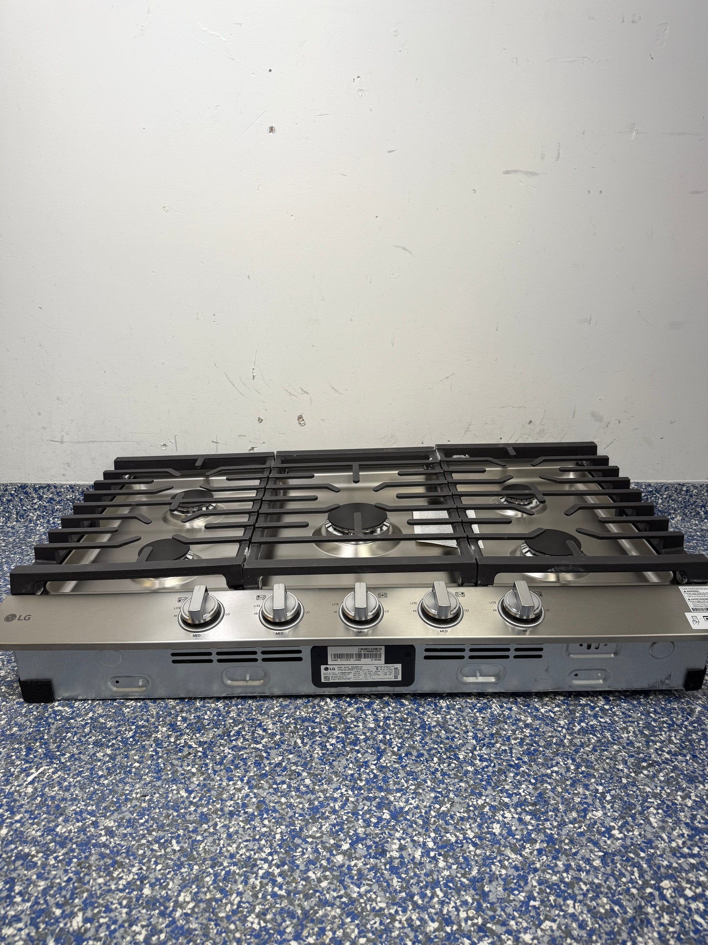 30 In. LG Built-In Cooktop with Cast Iron Grates, Propane Convertible, and Stainless Steel Cooktop at Appliance Shark Scratch and Dent Appliance Store in Overland Park, Kansas