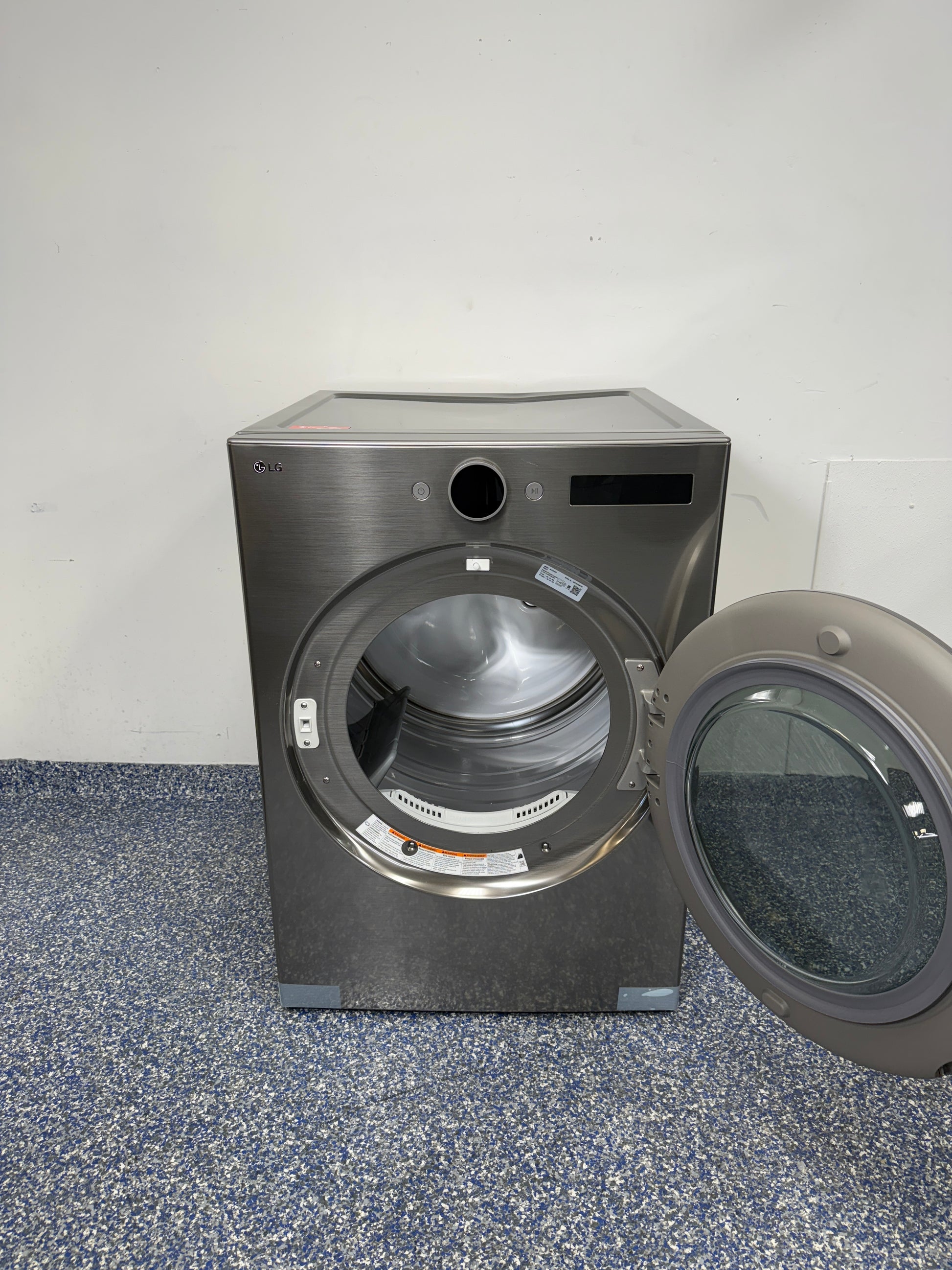 7.4 Cu.Ft. LG Stackable Smart Electric Dryer with FlowSense Duct Clogging & Lint Filter Indicators, Closet Depth Dimensions, LoDecibel Quiet Operation, Reversible Door, Stainless Drum, and Ultra Large Capacity at Appliance Shark Discount Store in Overland Park, Kansas