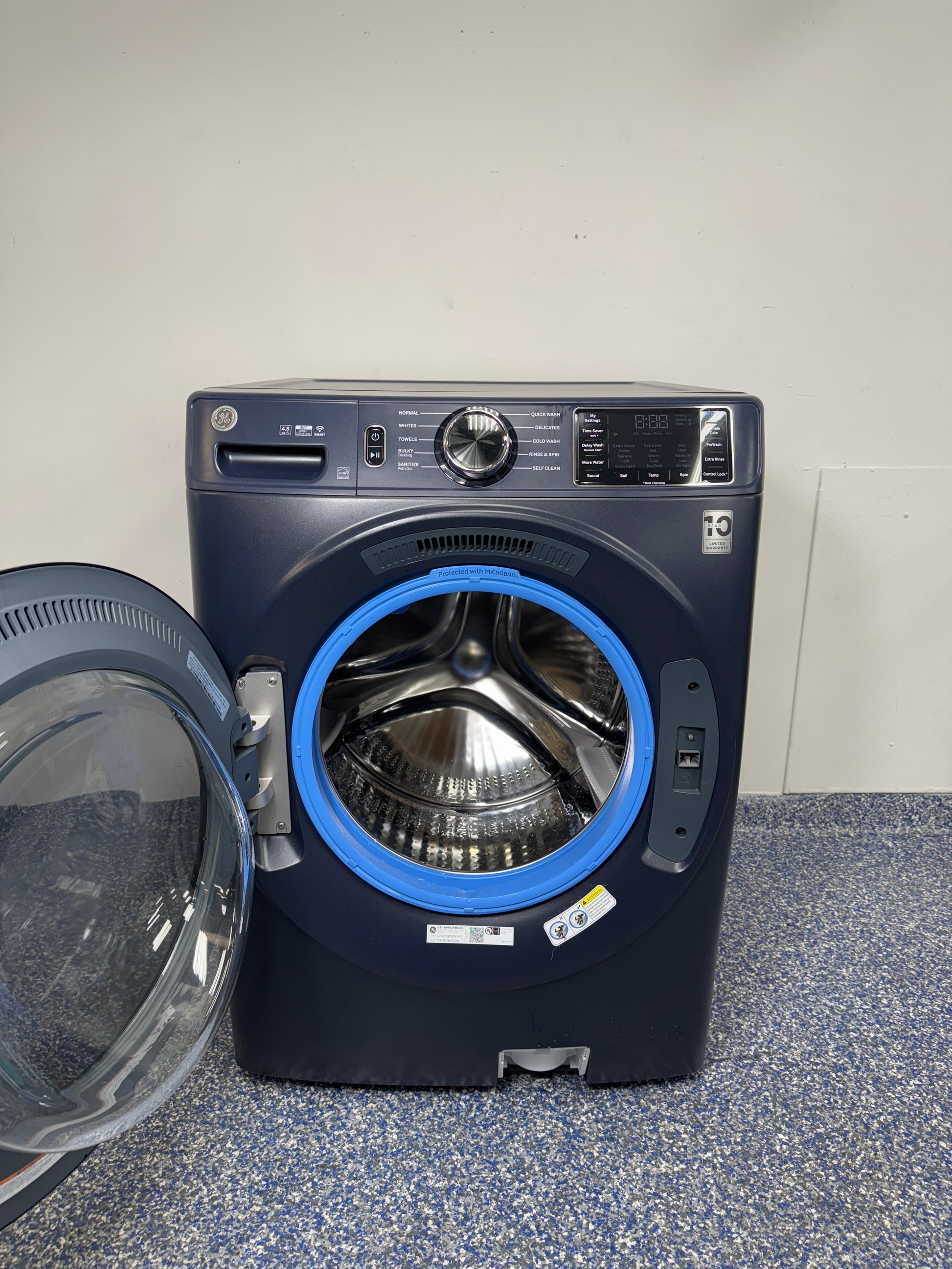 4.8 Cu.Ft. GE Stackable Smart Front Load Washing Machine with UltraFresh Vent System, Microban Technology, Dynamic Balancing Technology, Reversible Door, and Vibration Reduction at Appliance Shark Discount Store in Overland Park, Kansas