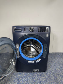 4.8 Cu.Ft. GE Stackable Smart Front Load Washing Machine with UltraFresh Vent System, Microban Technology, Dynamic Balancing Technology, Reversible Door, and Vibration Reduction at Appliance Shark Discount Store in Overland Park, Kansas
