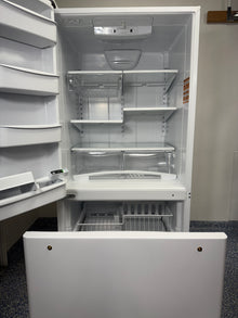 A close-up of the interior of the ABB2224BRW refrigerator, highlighting the SpillSaver™ glass shelves and Humidity-Controlled Garden Fresh™ crisper drawers. On sale at Appliance Shark - Scratch & Dent store | Kansas City.