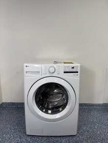 A full frontal photo of the LG WM3400CW front-load washer in white, showcasing its sleek design and digital controls. This scratch and dent appliance is available at a discount in Kansas City.