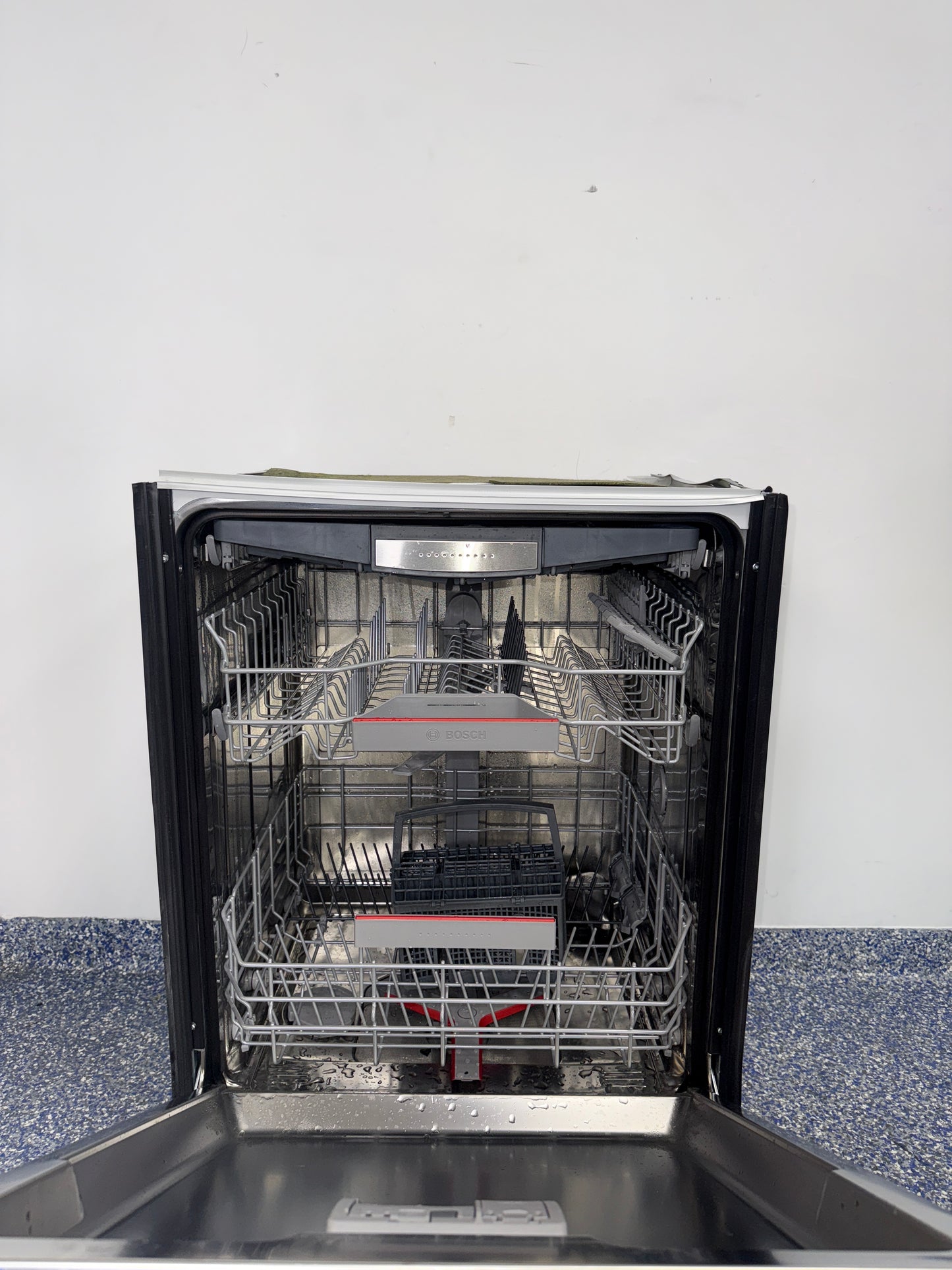 A close-up view of the interior of the BOSCH 800 Series dishwasher, showcasing its MyWay Rack, an ideal appliance for homes in Overland Park, KS.