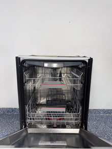 A close-up view of the interior of the BOSCH 800 Series dishwasher, showcasing its MyWay Rack, an ideal appliance for homes in Overland Park, KS.