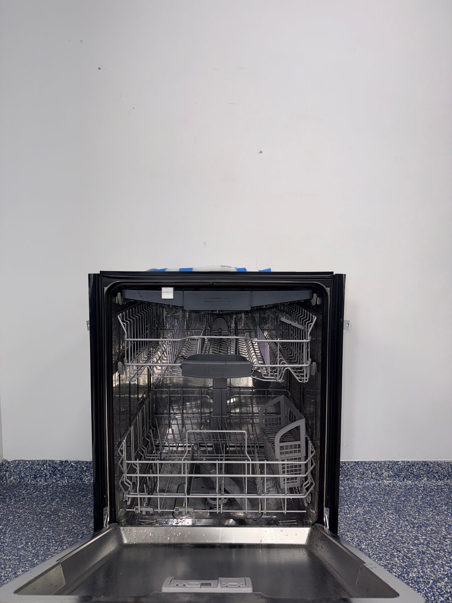 A close-up view of the interior of the BOSCH 800 Series dishwasher, showcasing its MyWay Rack, an ideal appliance for homes in Overland Park, KS.