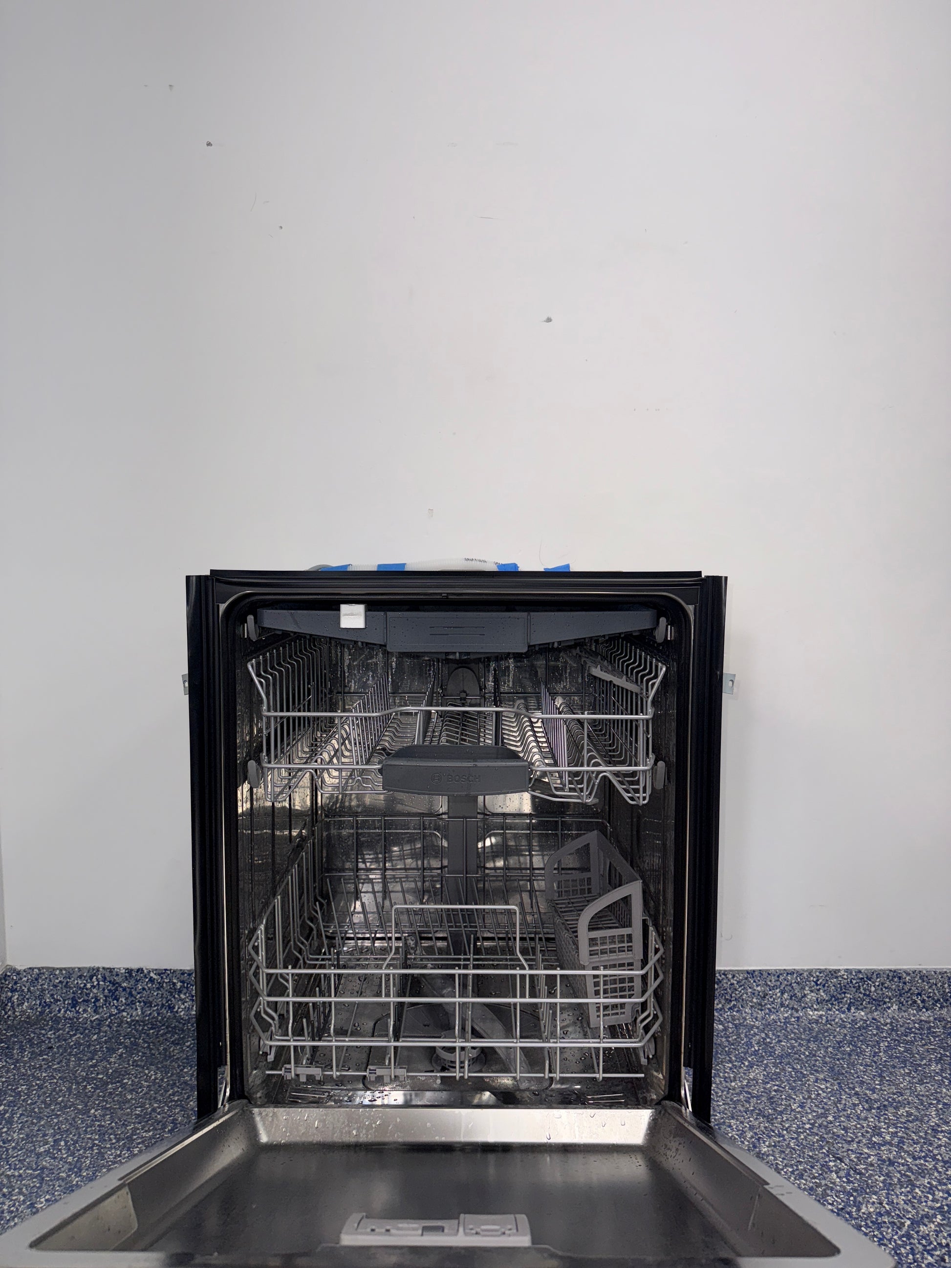 A close-up view of the interior of the BOSCH 800 Series dishwasher, showcasing its MyWay Rack, an ideal appliance for homes in Overland Park, KS.