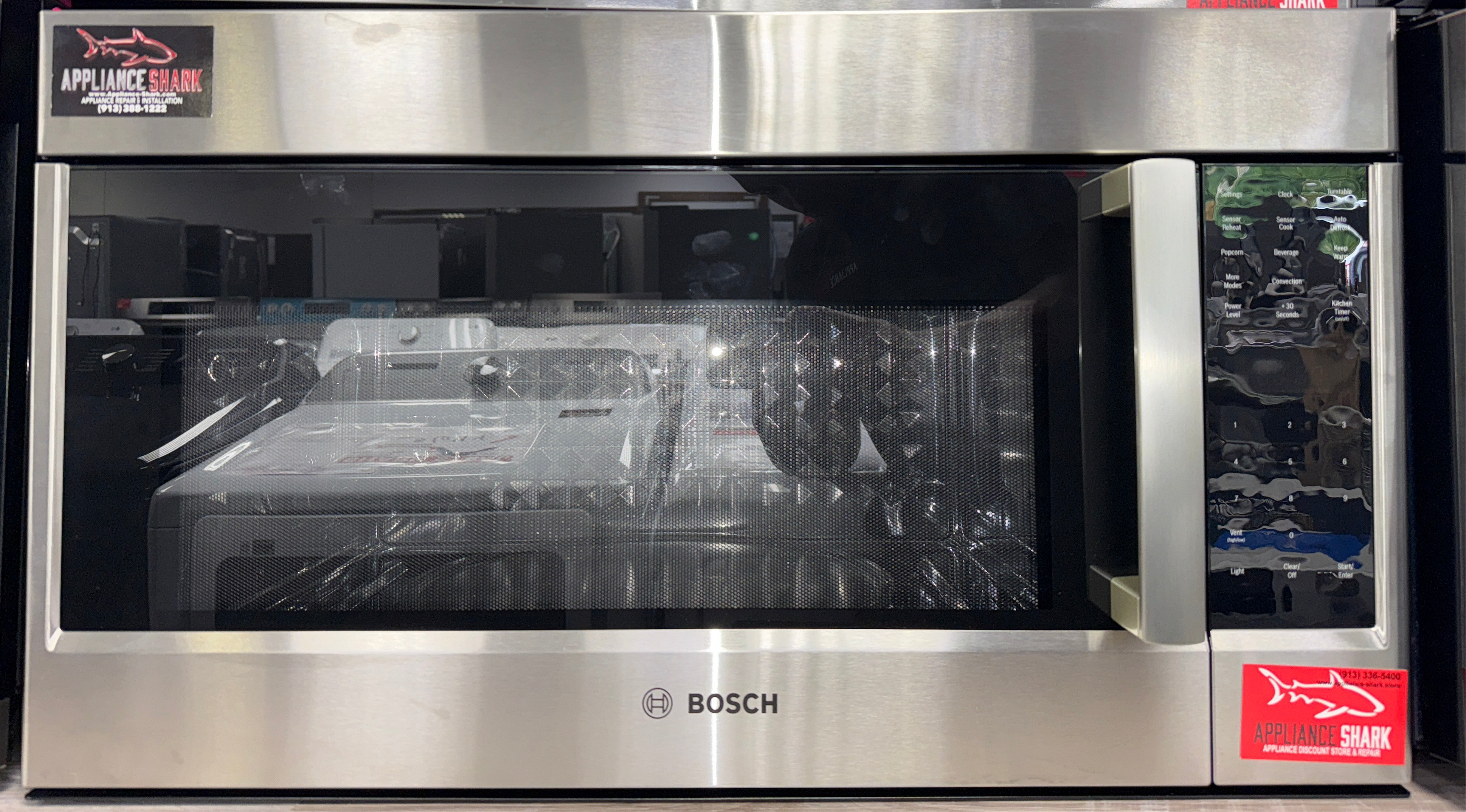 The BOSCH HMV8054U microwave from the front, highlighting its Sensor Cooking technology and a great deal in Kansas.