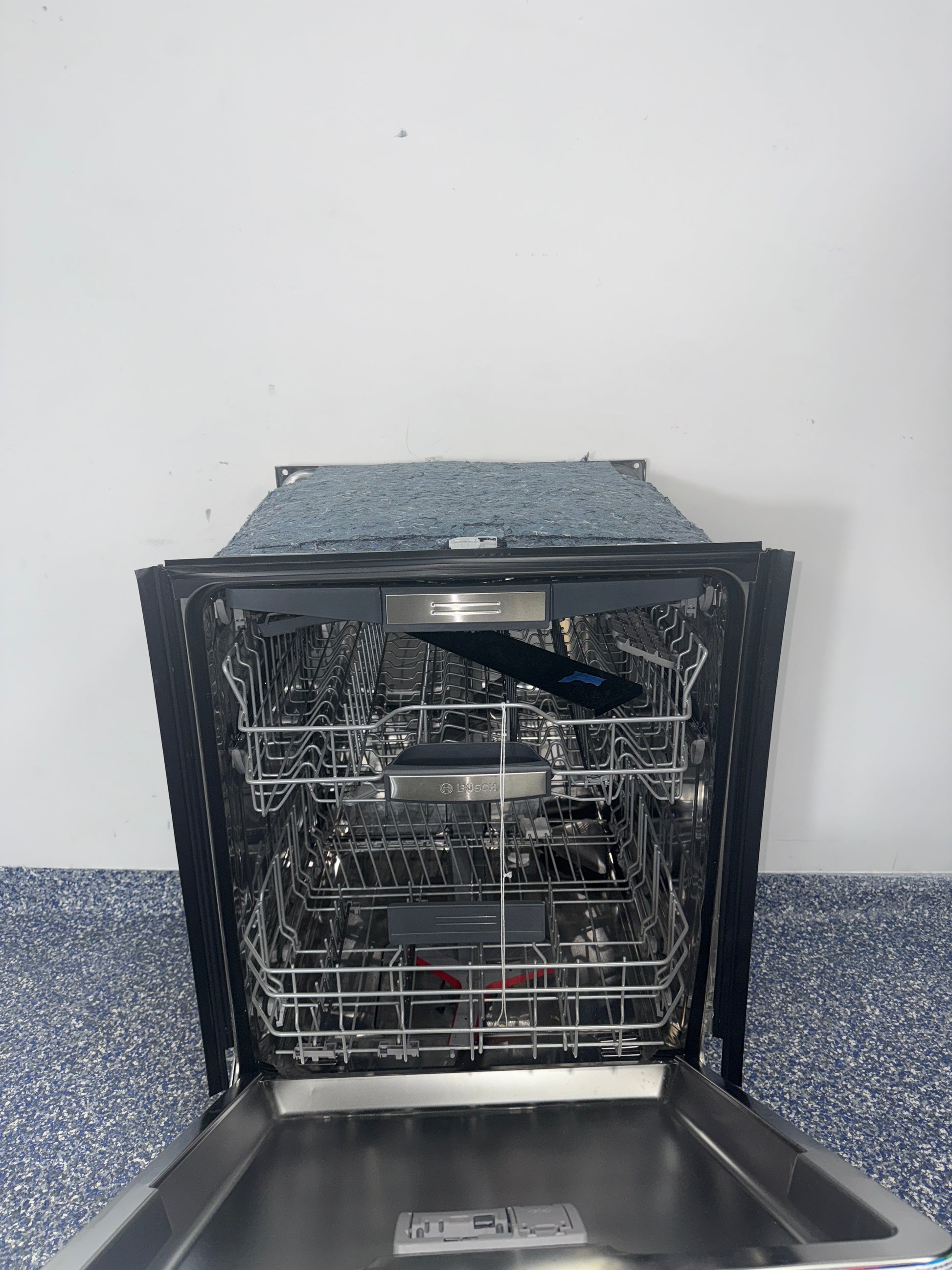 Interior view showing flexible racking of the BOSCH SHP78CM5N dishwasher, featured in Kansas City homes.