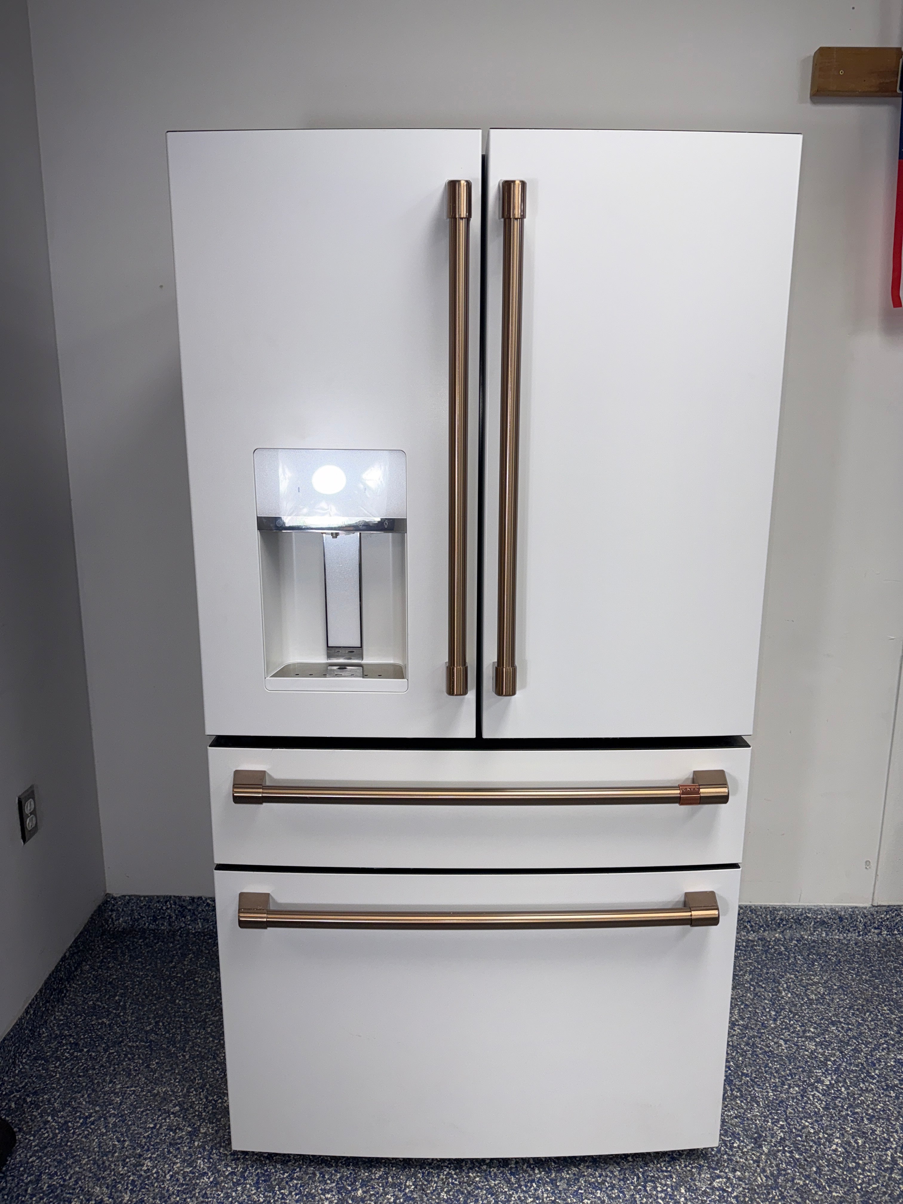 Front view of the CAFE CXE22DP4PFW2 French door refrigerator available in Overland Park near Kansas City.
