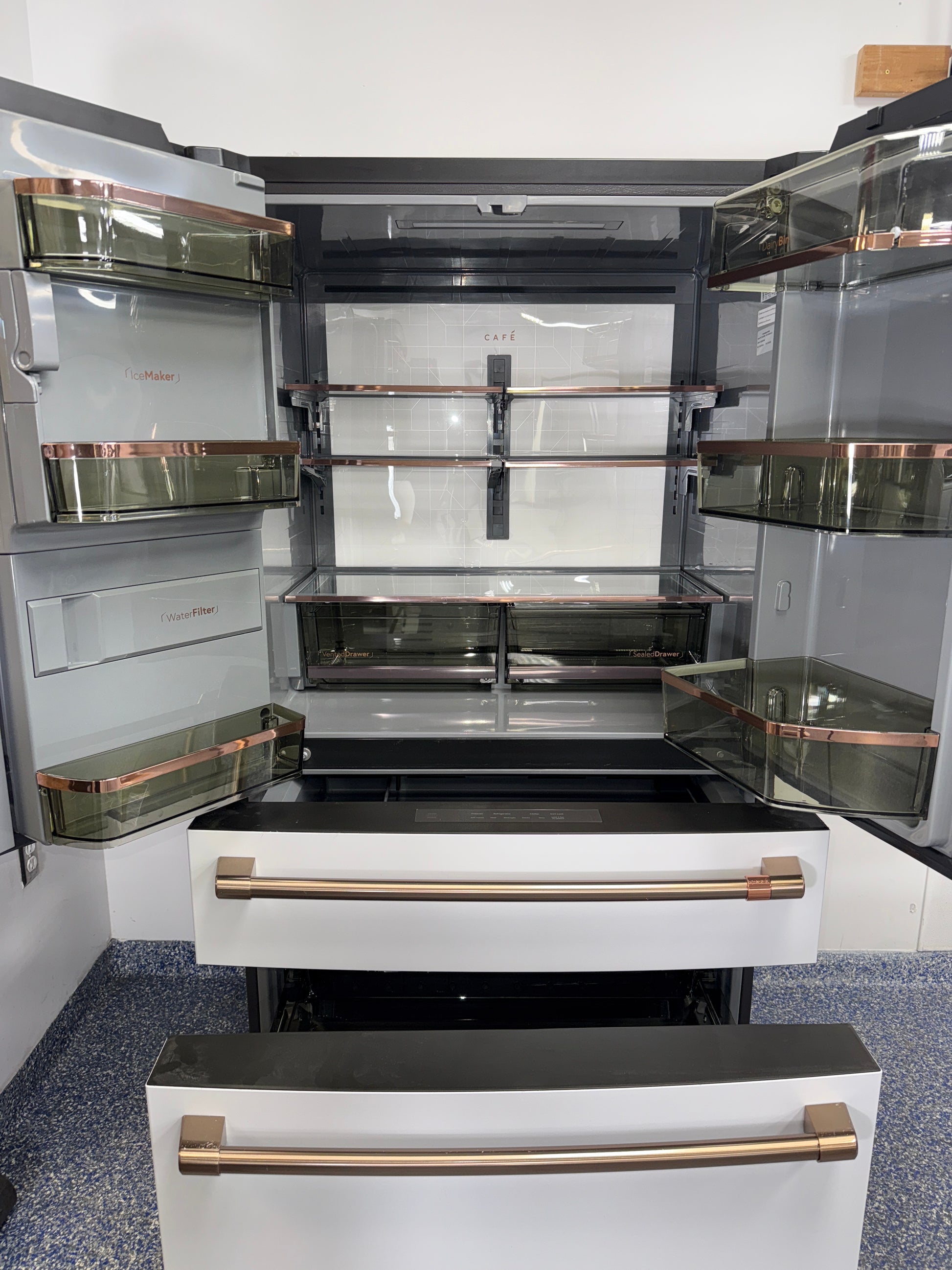 Interior shelving layout of the CAFE CXE22DP4PFW2 French door refrigerator in the Kansas City Metro area.