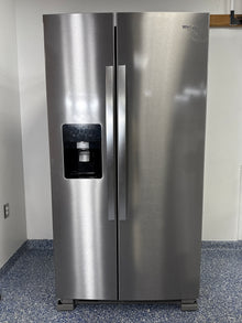A full view of the Whirlpool WRS325SDHZ side-by-side refrigerator in fingerprint-resistant stainless steel with an exterior water and ice dispenser. Find this great deal at Appliance Shark in Overland Park.