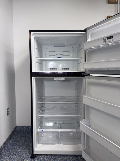 The interior of the FRIGIDAIRE FFTR1814WB refrigerator, showcasing its adjustable shelves, an ideal appliance for homes in Overland Park.