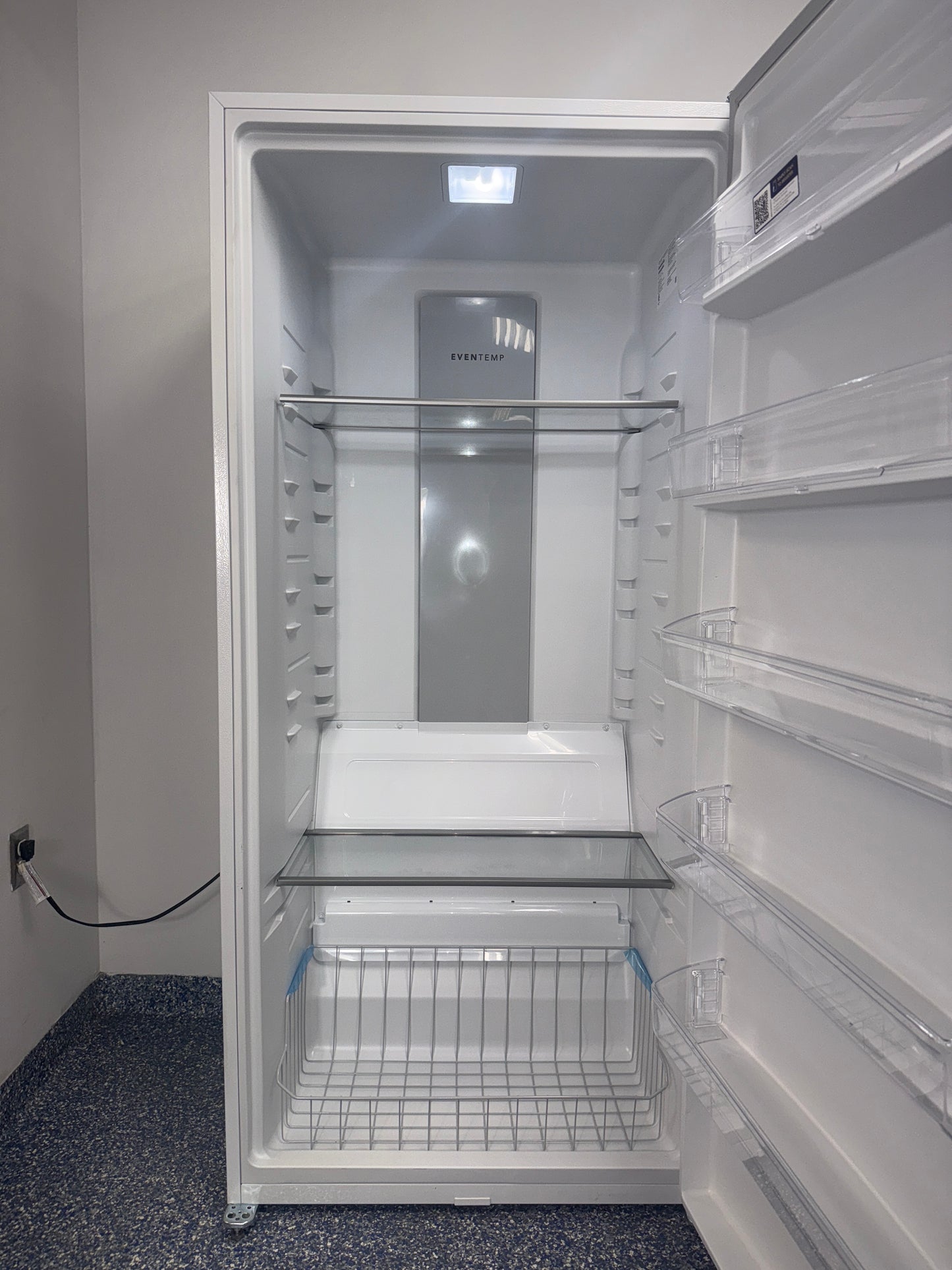 The interior of the FRIGIDAIRE FFUE2024AW freezer, showing the EvenTemp Cooling System, an ideal appliance for homes in Overland Park, KS.
