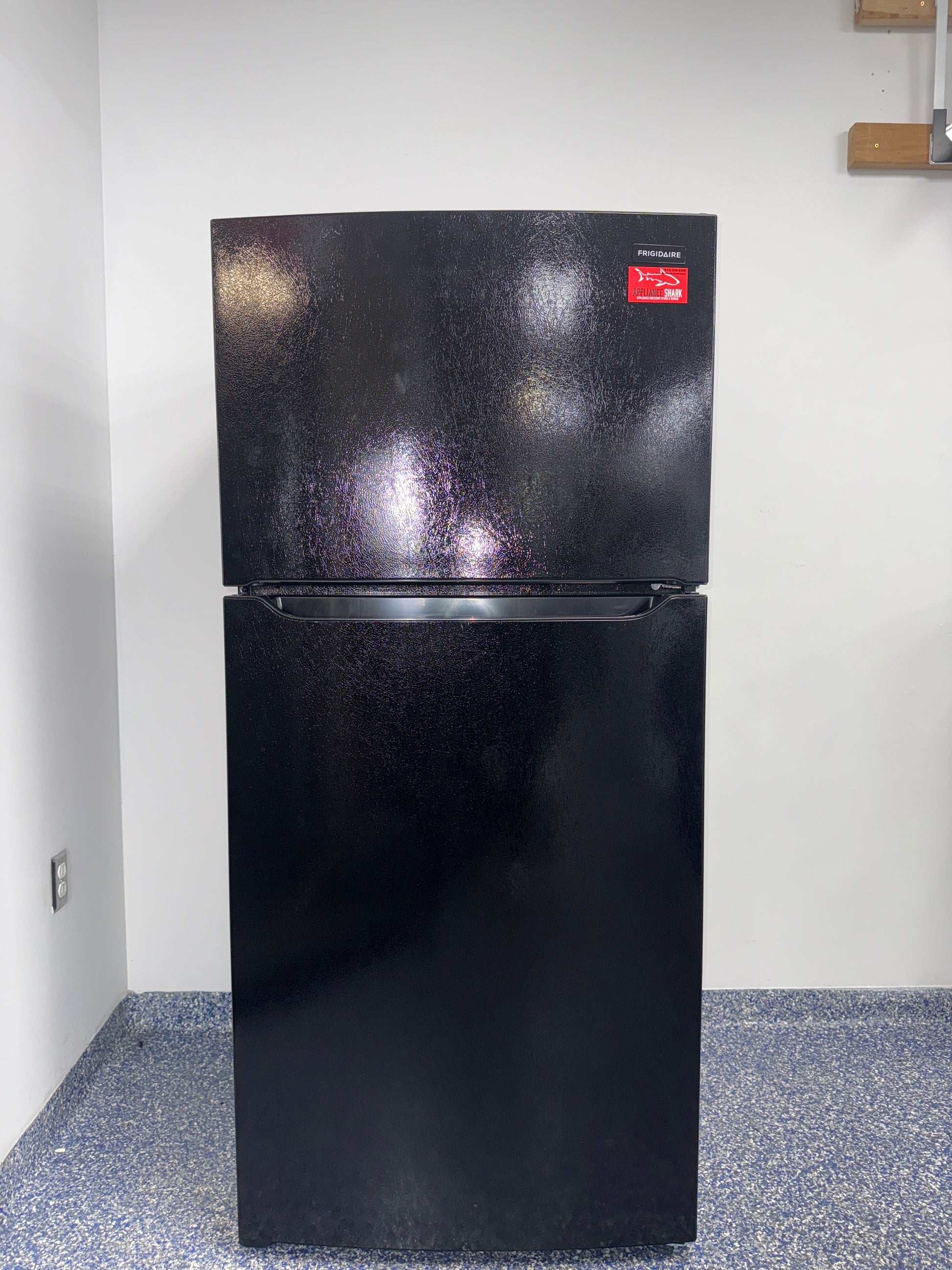 The FRIGIDAIRE FFTR1814WB refrigerator from the front, a top-freezer model for a great deal in Kansas.