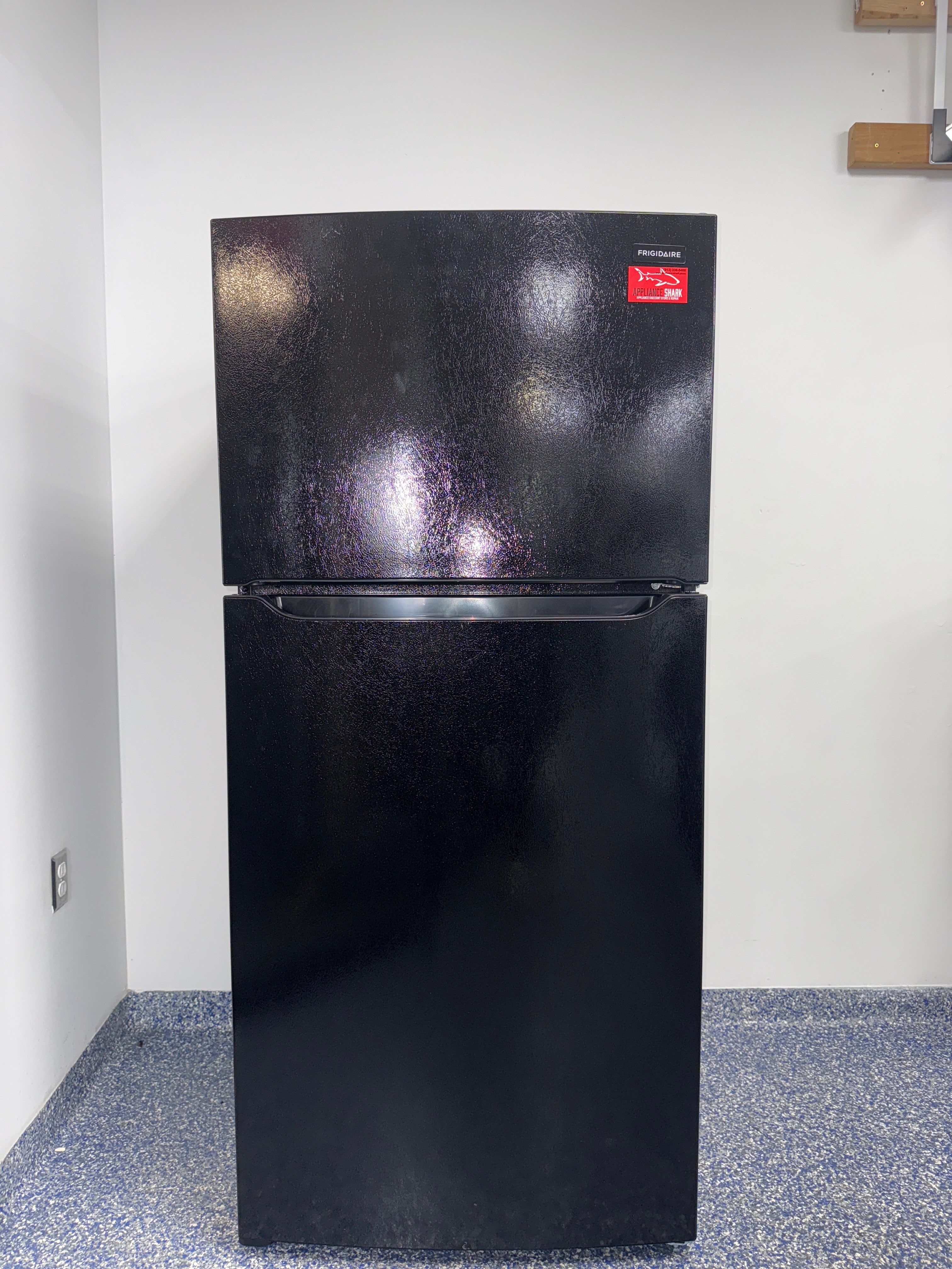 The FRIGIDAIRE FFTR1814WB refrigerator from the front, a top-freezer model for a great deal in Kansas.