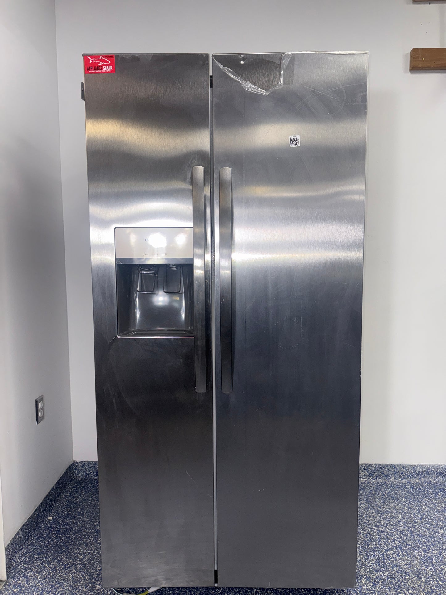 The FRIGIDAIRE FRSS2323AS refrigerator from the front, a side-by-side model for a great deal in Kansas.