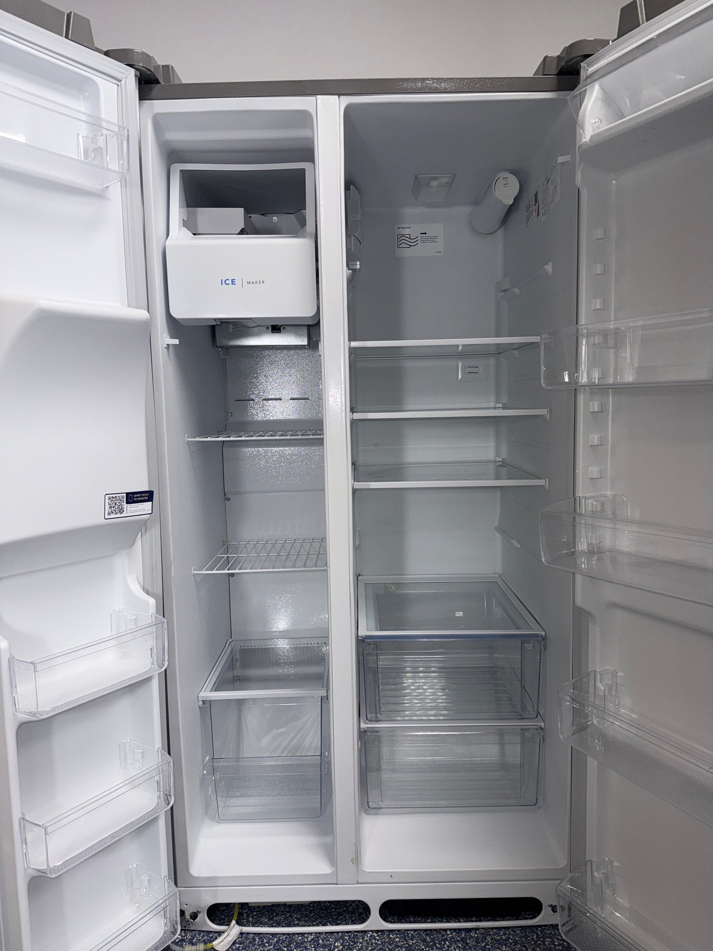 Interior view of the FRIGIDAIRE FRSS26L3AF refrigerator showing adjustable glass shelves and storage capacity for Overland Park, KS homes.