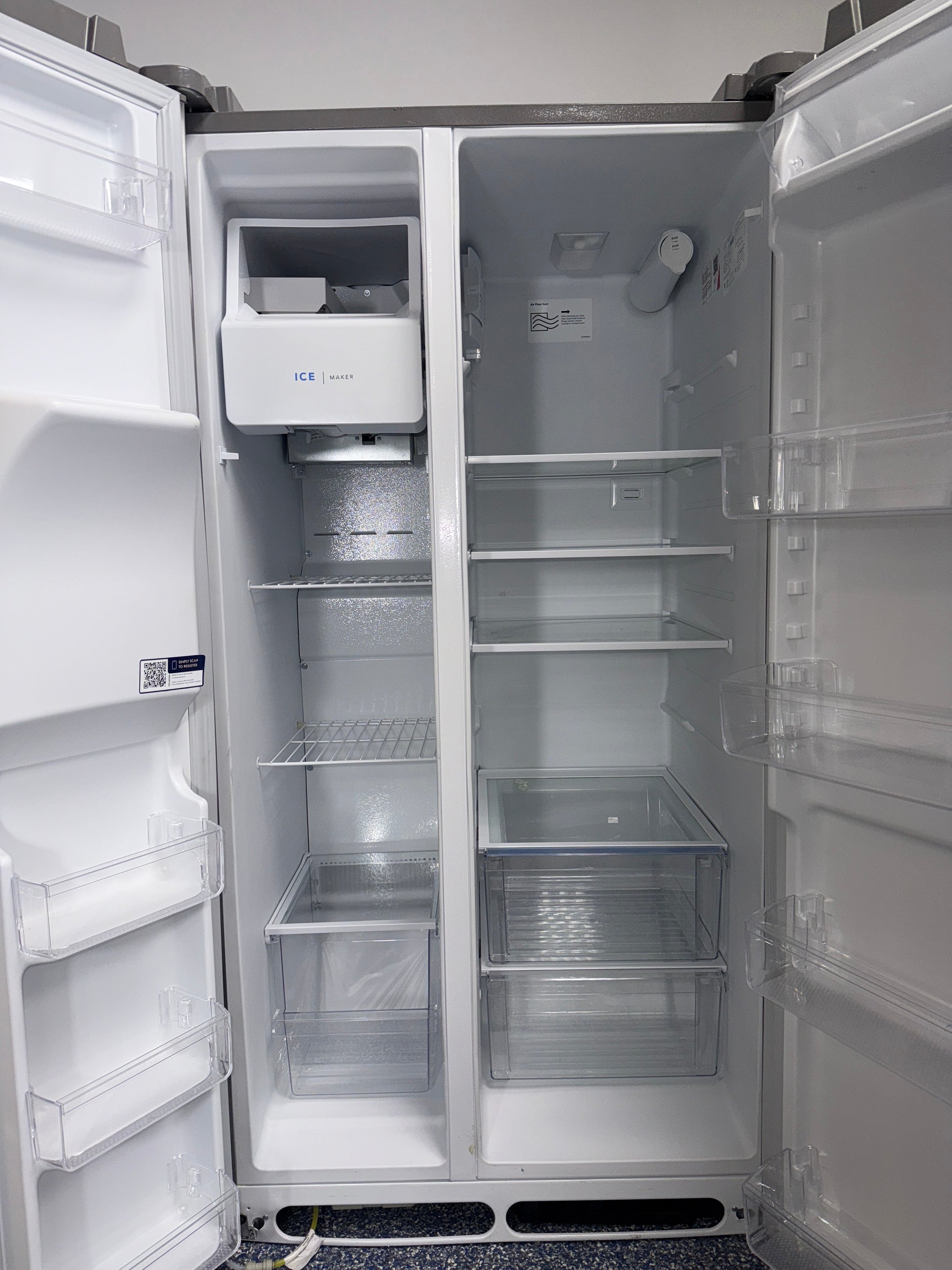 Interior view of the FRIGIDAIRE FRSS26L3AF refrigerator showing adjustable glass shelves and storage capacity for Overland Park, KS homes.