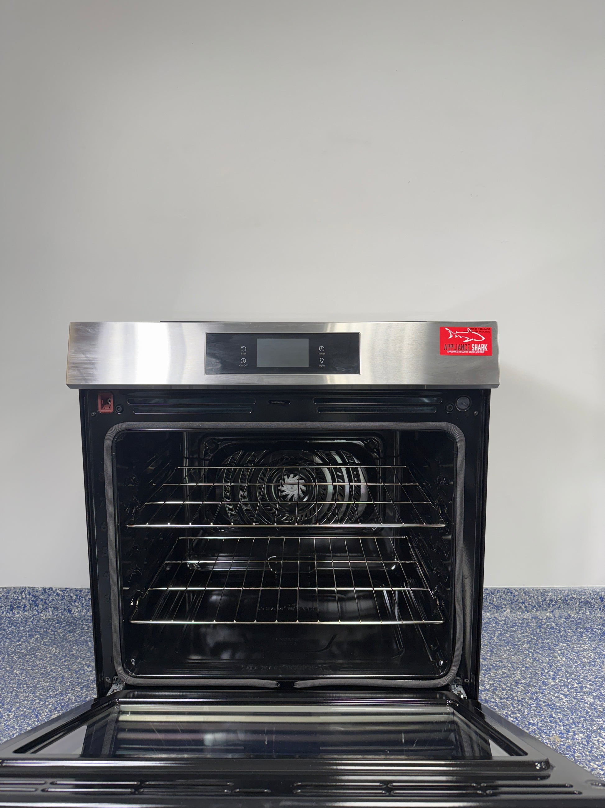Induction cooktop surface of FRIGIDAIRE GCFI3060BF range, available as a scratch and dent deal in Kansas City.