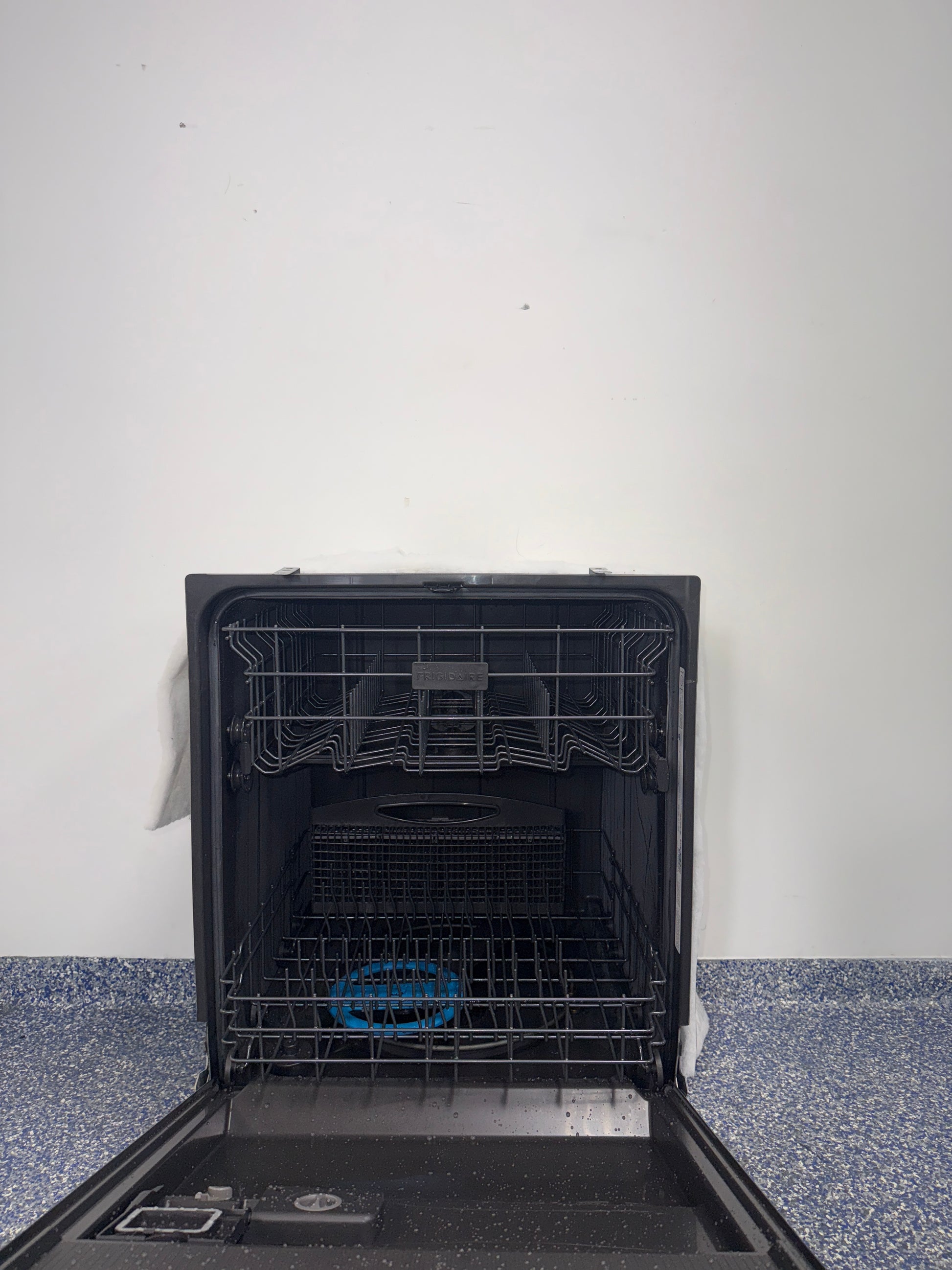 A front view of the FRIGIDAIRE GDPH4525AF dishwasher, highlighting its stainless steel tub, ready for installation in a Kansas City kitchen.