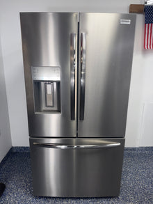 Front view of the FRIGIDAIRE GRFS2853AFM French door refrigerator with stainless steel finish in a Kansas City kitchen.