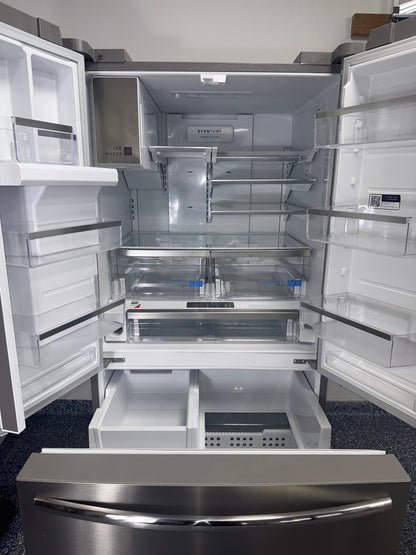 Interior view of the FRIGIDAIRE GRFS2853AFM refrigerator showing wide adjustable shelves and storage capacity for Overland Park, KS homes.