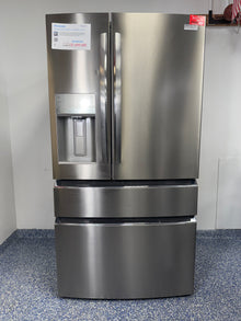 A full frontal image of the FRIGIDAIRE GRMC2273CF French door refrigerator, highlighting its Smudge-Proof® Stainless Steel finish and external dispenser. On sale at Appliance Shark - Scratch & Dent store | Kansas City.