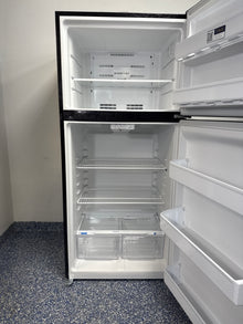 Scratch & dent FRIGIDAIRE FFTR1814WB refrigerator displayed at Appliance Shark in Overland Park with classic black design.