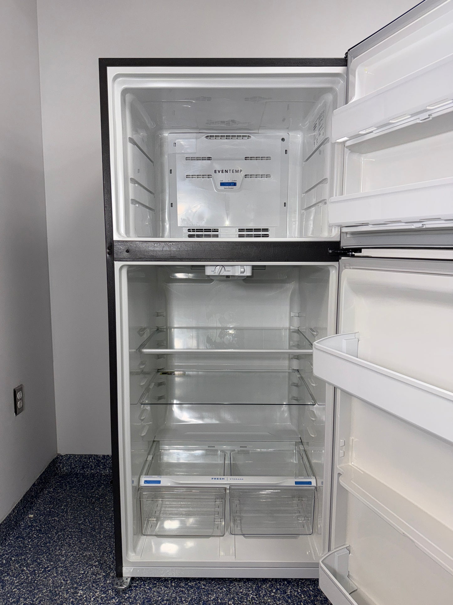 The FRIGIDAIRE top-freezer refrigerator, model LFTR1835VF, with its adjustable glass shelves, available at Appliance Shark.

