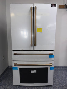 The GE CAFÉ CGE29DP4TW2 refrigerator from the front, highlighting its LED Light Wall and a great deal in Kansas.