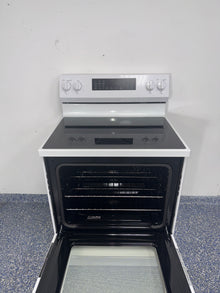 GE GRF600AV2WW electric range smooth cooktop view in Overland Park KS