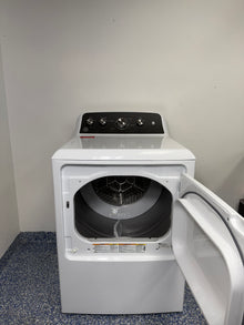 An overhead shot of the GE GTD48EASWWB with the door open, showcasing the 7.2 cu ft aluminized alloy drum. On sale at Appliance Shark - Scratch & Dent store | Kansas City.