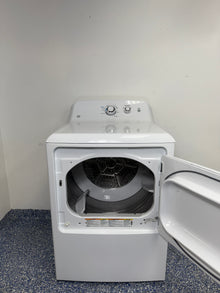 An overhead shot of the GE GTX33EASKWW with the door open, showcasing the 6.2 cu ft aluminized alloy drum. On sale at Appliance Shark - Scratch & Dent store | Kansas City.
