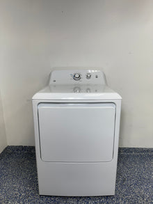 A full frontal image of the GE GTX33EASKWW front-load electric dryer, highlighting its clean white finish and control panel. On sale at Appliance Shark - Scratch & Dent store | Kansas City.