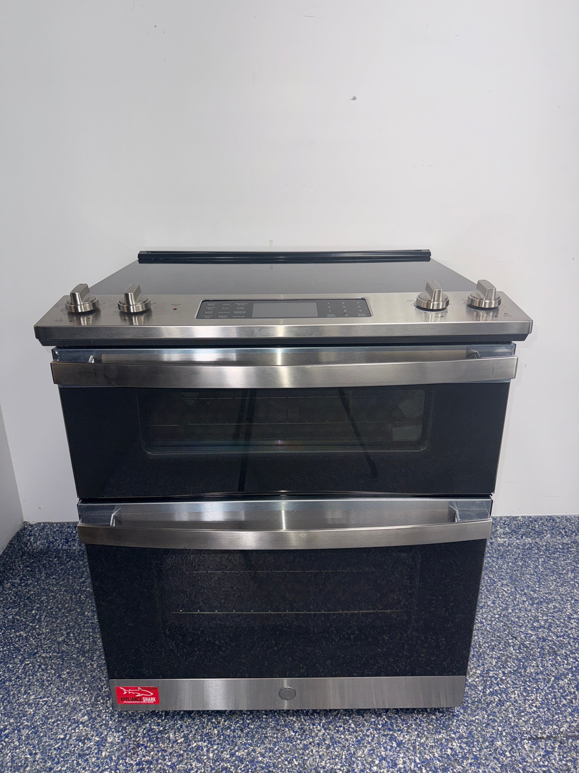 Front view of the GE JSS86SP8SS 30-inch double oven electric range in stainless steel, available in Overland Park, KS.