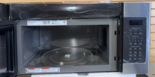 Interior of GE JVM7195SKSS microwave showing spacious 1.9 cu. ft. capacity, available as a scratch and dent deal in Kansas City.