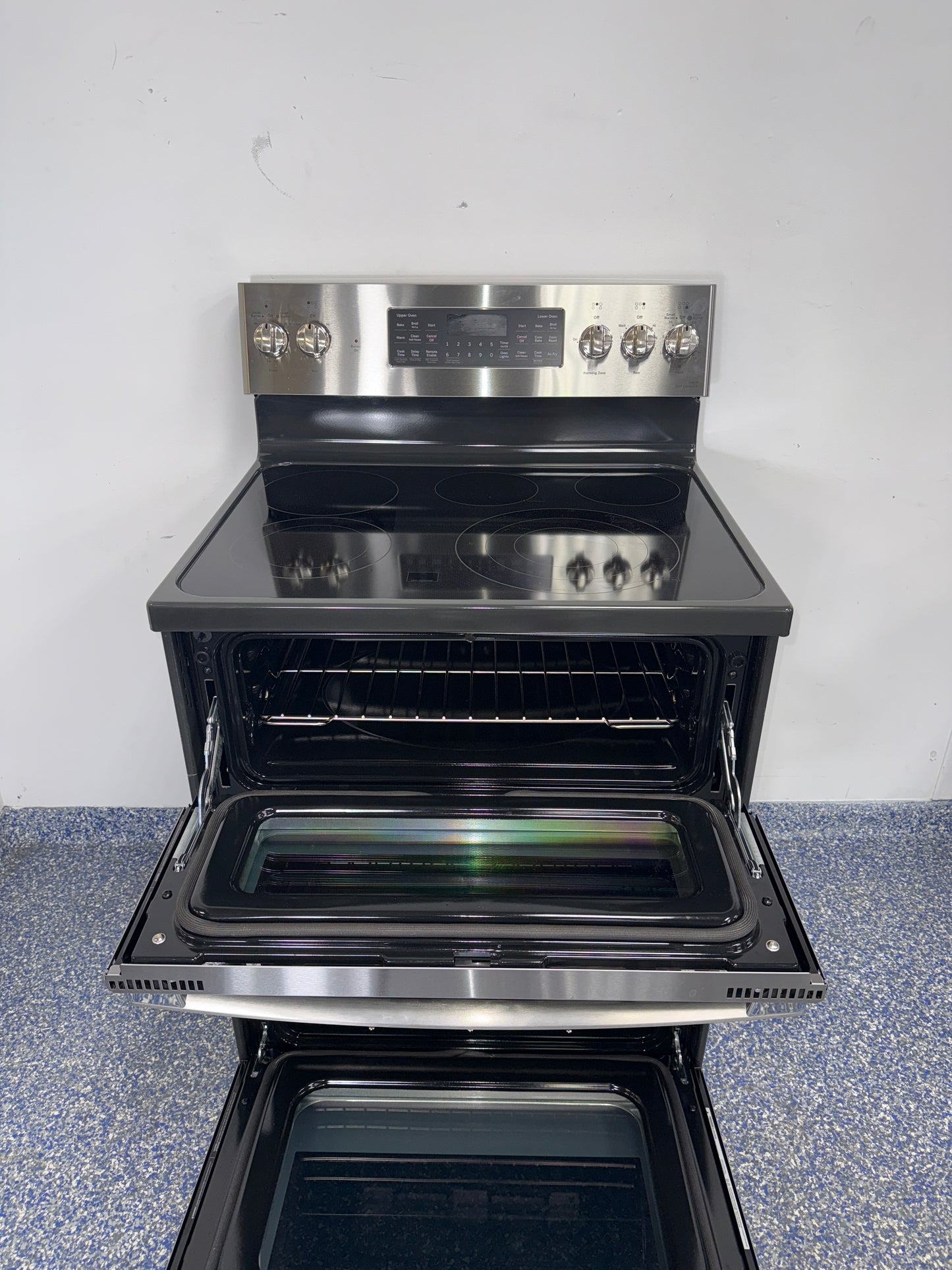 Double oven interior of GE Profile PB965YP5FS electric range in a Kansas City kitchen.