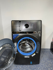 An overhead shot of the GE Profile PFQ97HSPVDS with the door open, revealing the spacious stainless steel drum. On sale at Appliance Shark - Scratch & Dent store | Kansas City.