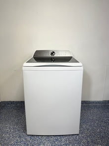 A full frontal image of the GE Profile PTW600BSRWS top-load smart washer, showcasing its clean white finish and glass lid. On sale at Appliance Shark - Scratch & Dent store | Kansas City.