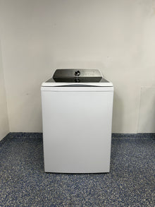 A full frontal image of the GE Profile PTW600BSRWS top-load smart washer, showcasing its clean white finish and glass lid. On sale at Appliance Shark - Scratch & Dent store | Kansas City.