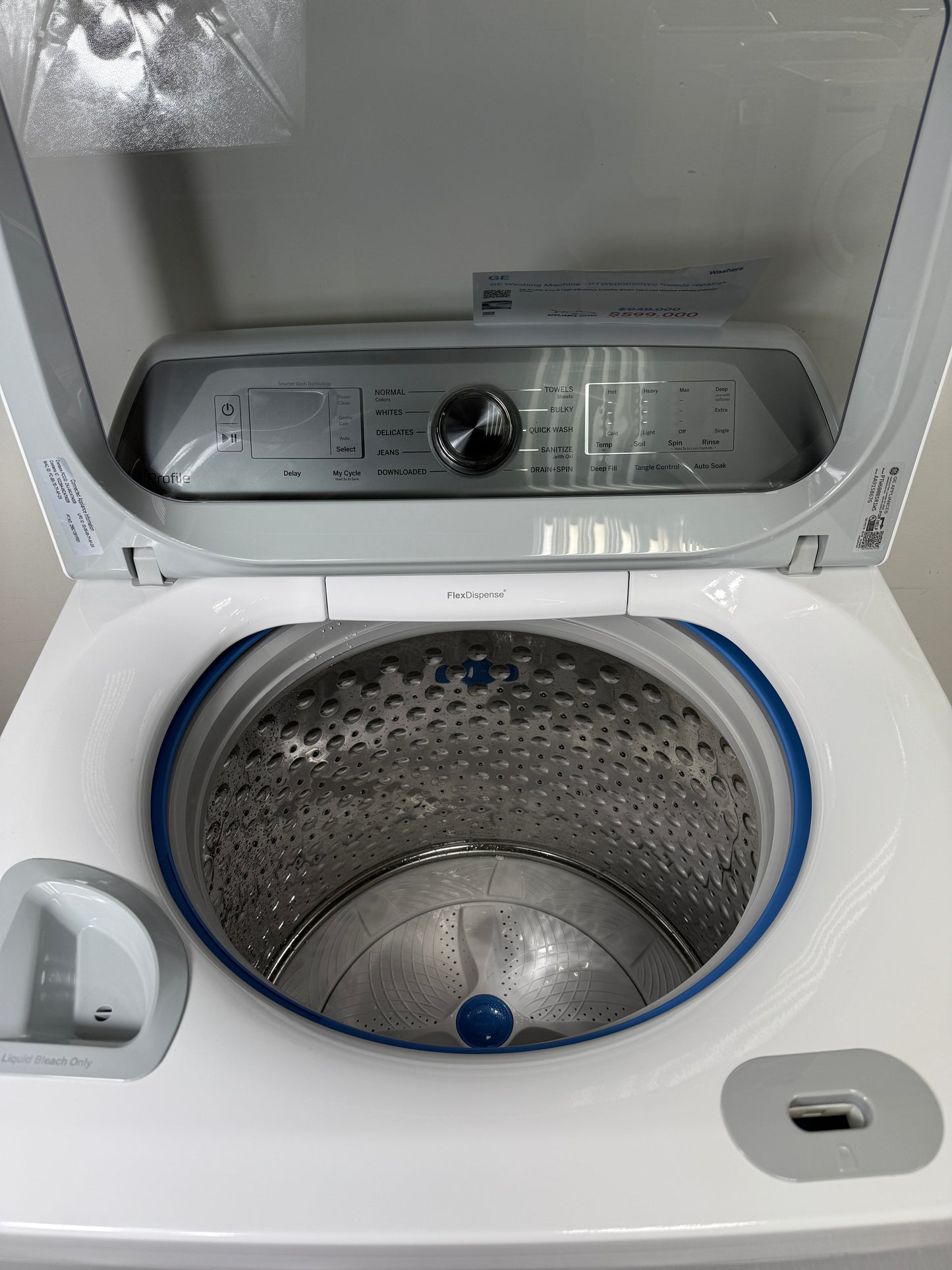 A close-up of the stainless steel wash drum interior of the PTW600BSRWS washer, featuring Microban® Antimicrobial Technology. On sale at Appliance Shark - Scratch & Dent store | Kansas City.