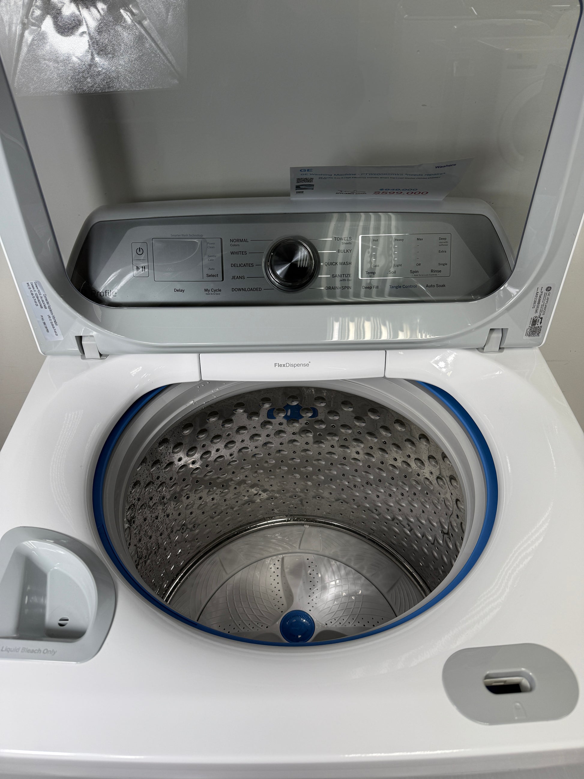 A close-up of the stainless steel wash drum interior of the PTW600BSRWS washer, featuring Microban® Antimicrobial Technology. On sale at Appliance Shark - Scratch & Dent store | Kansas City.