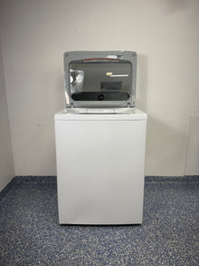 An overhead shot of the GE PTW600BSRWS with the lid open, showcasing the spacious stainless steel tub and Smart FlexDispense™. On sale at Appliance Shark - Scratch & Dent store | Kansas City.