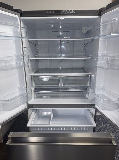 Interior view of the HISENSE HRF266N6CSE1 refrigerator showing adjustable glass shelves and wide storage for Overland Park, KS homes.