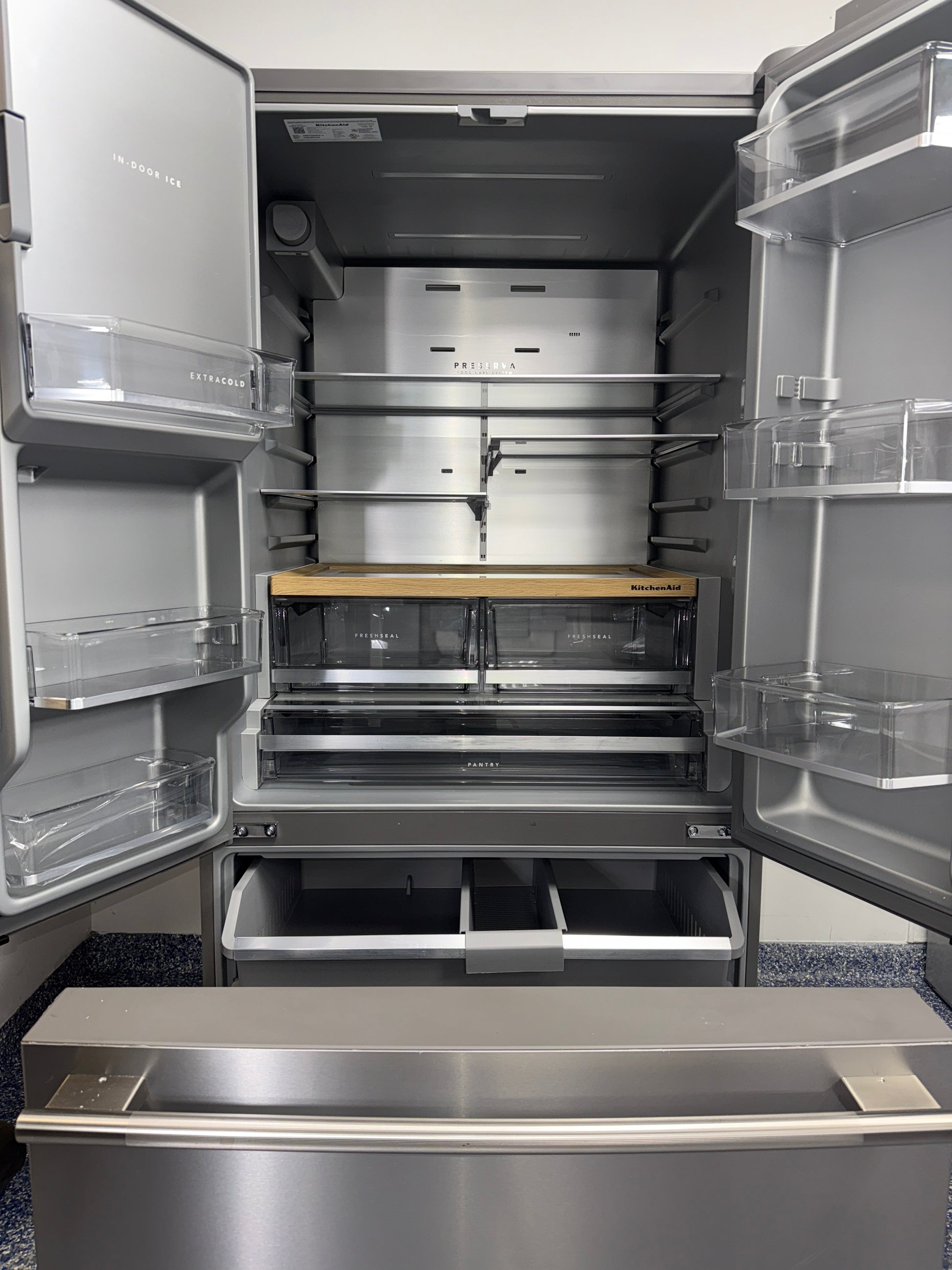Open interior view showing adjustable shelves and pantry drawers of the KITCHENAID KRFF436SPS, featured in Kansas City homes.