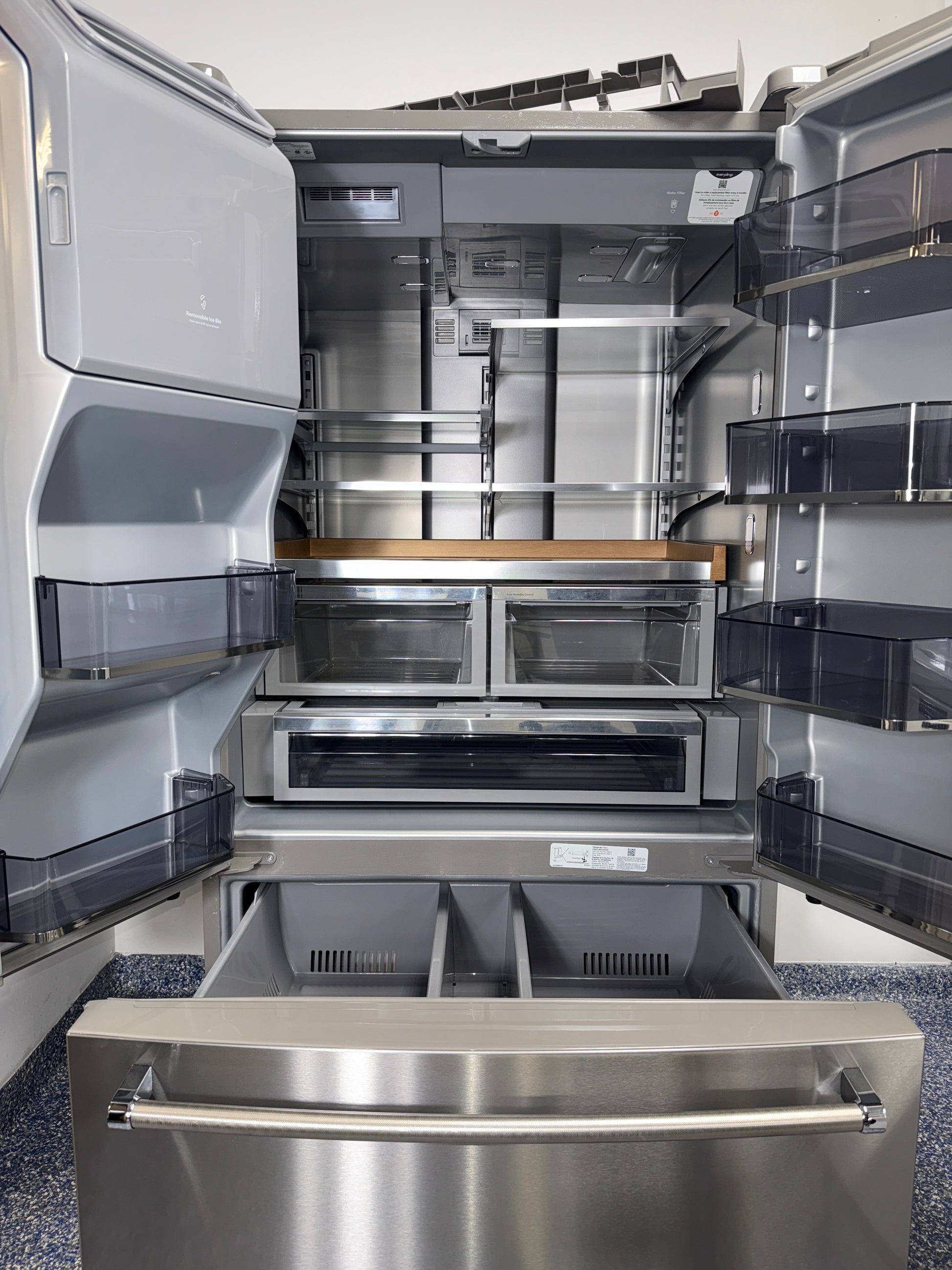 A close-up view of the internal water dispenser on the KITCHENAID KRFF577KPS, for sale in Kansas.
