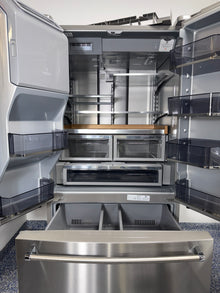 A close-up view of the internal water dispenser on the KITCHENAID KRFF577KPS, for sale in Kansas.