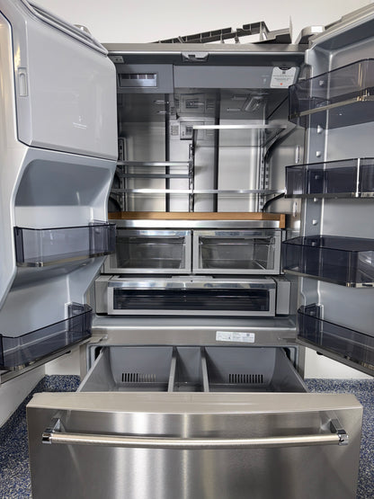 A close-up view of the internal water dispenser on the KITCHENAID KRFF577KPS, for sale in Kansas.