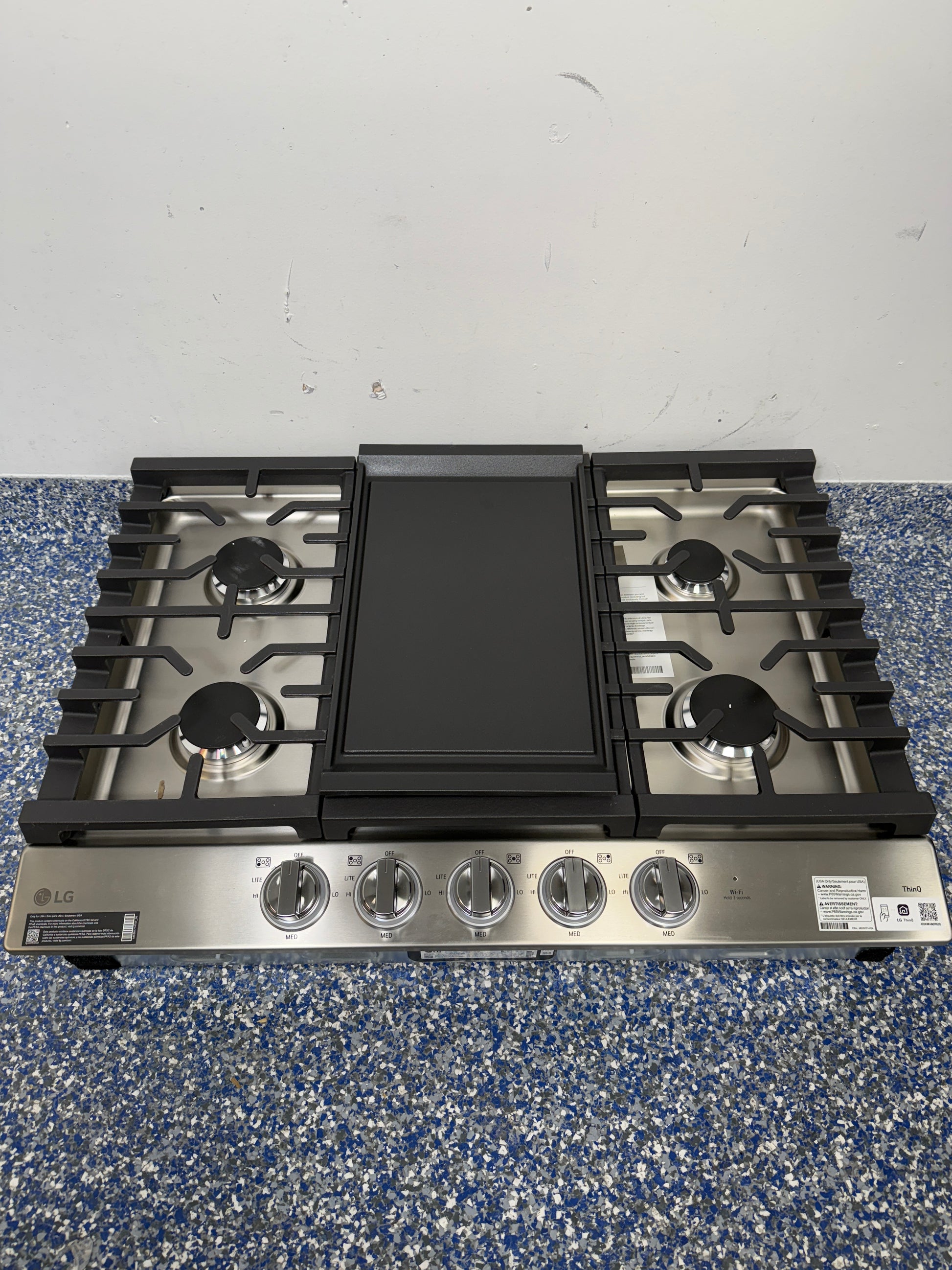 LG CBGJ3027S gas cooktop burners and grates in Kansas City